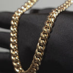Load and play video in Gallery viewer, 10K Yellow Gold Cuban Link Chain (12MM)

